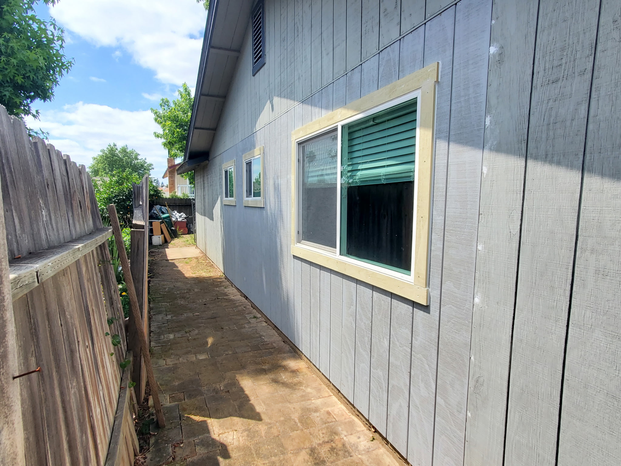 Exterior siding replacement with new windows and trim